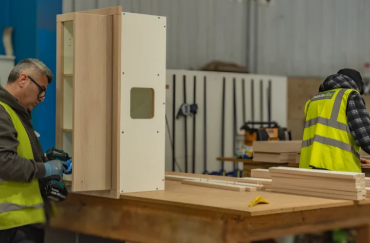 Workers assembling bespoke lockers